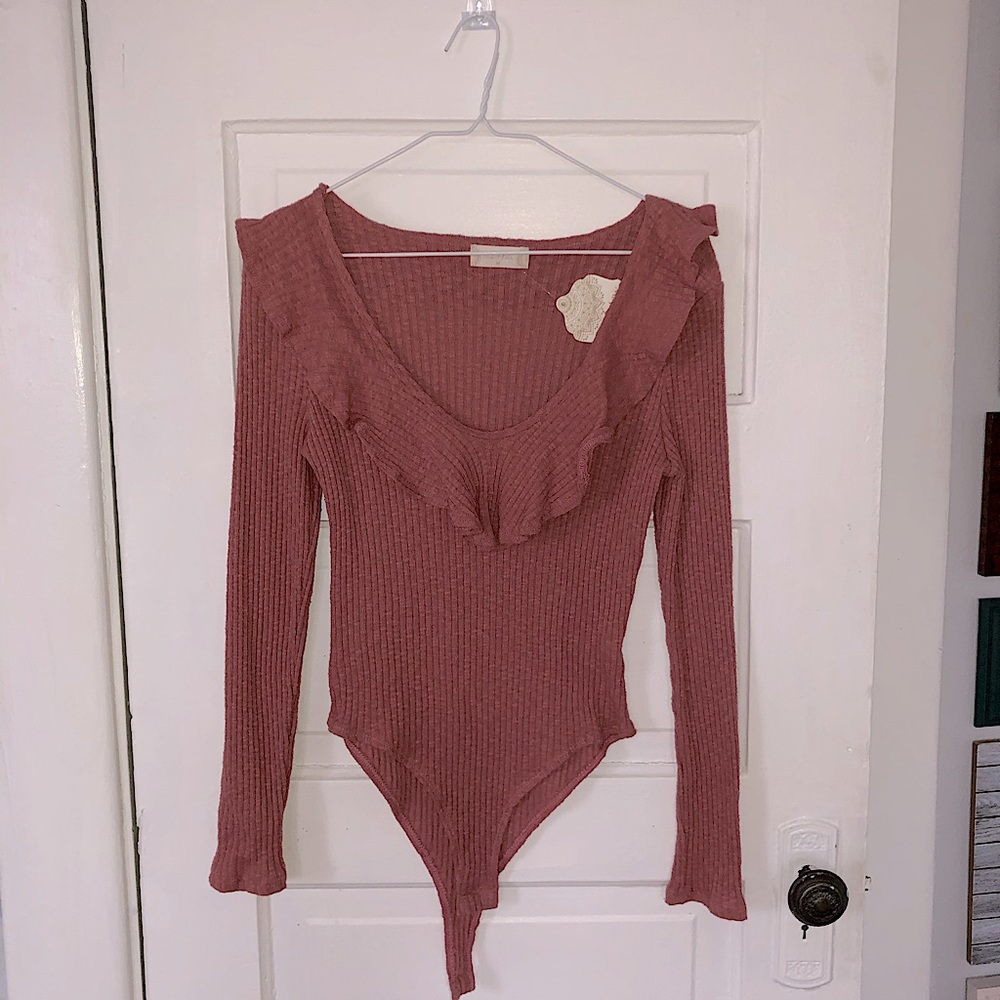 New pink ruffled top body suit from Altar’d State